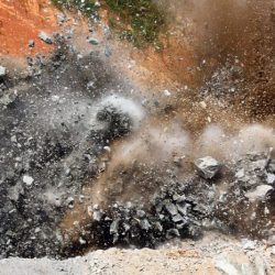 A dynamite blast at a quarry launches